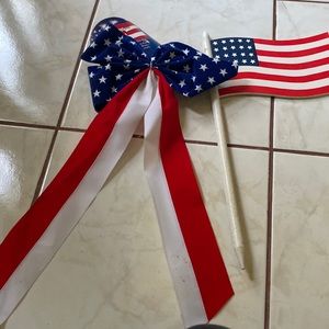 Set of one solid wood flag, and a brand new patriotic bow